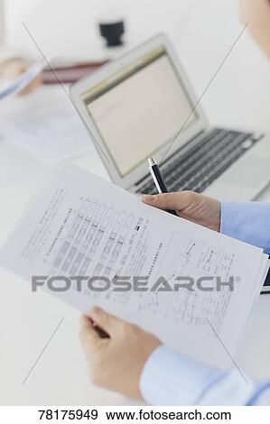Japanese businessman working View Large Photo Image Stock Photo - Japanese businessman working. Fotosearch