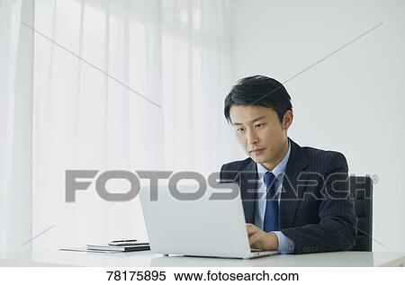 Japanese businessman working View Large Photo Image Stock Photography - Japanese businessman working. Fotosearch
