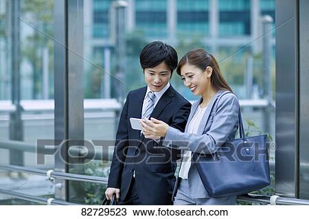 Japanese businesspeople downtown Tokyo View Large Photo Image Stock Image - Japanese businesspeople downtown Tokyo. Fotosearch