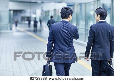 Japanese businesspeople downtown Tokyo View Large Photo Image Stock Photo - Japanese businesspeople downtown Tokyo. Fotosearch