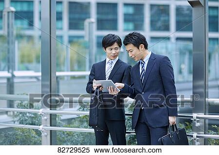Japanese businesspeople downtown Tokyo View Large Photo Image Stock Photography - Japanese businesspeople downtown Tokyo. Fotosearch