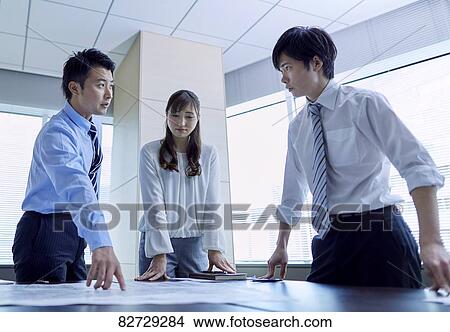 Japanese businesspeople in a meeting View Large Photo Image Picture - Japanese businesspeople in a meeting. Fotosearch