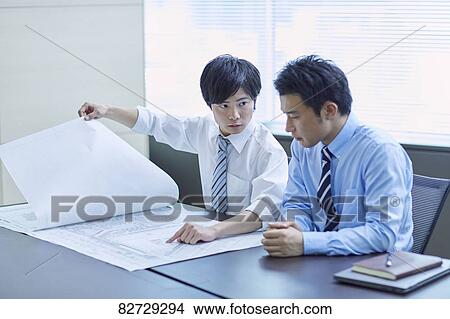 Japanese businesspeople in a meeting View Large Photo Image Picture - Japanese businesspeople in a meeting. Fotosearch