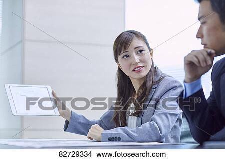 Japanese businesspeople in a meeting View Large Photo Image Picture - Japanese businesspeople in a meeting. Fotosearch