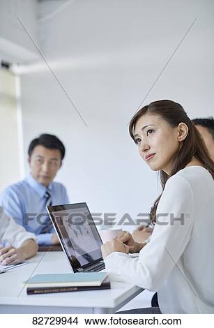 Japanese businesspeople in a meeting View Large Photo Image Picture - Japanese businesspeople in a meeting. Fotosearch