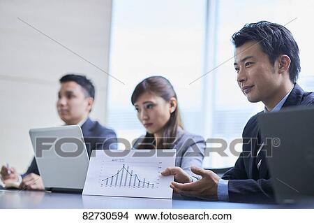 Japanese businesspeople in a meeting View Large Photo Image Picture - Japanese businesspeople in a meeting. Fotosearch