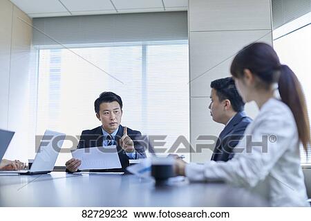 Japanese businesspeople in a meeting View Large Photo Image Stock Image - Japanese businesspeople in a meeting. Fotosearch