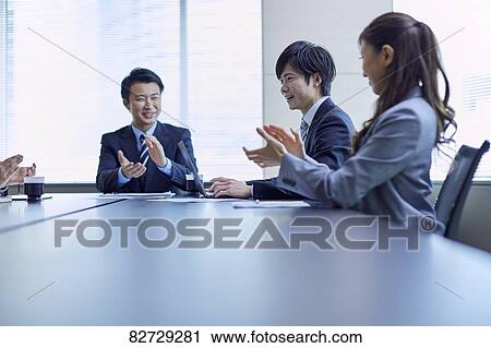 Japanese businesspeople in a meeting View Large Photo Image Stock Image - Japanese businesspeople in a meeting. Fotosearch