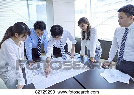 Japanese businesspeople in a meeting View Large Photo Image Stock Image - Japanese businesspeople in a meeting. Fotosearch