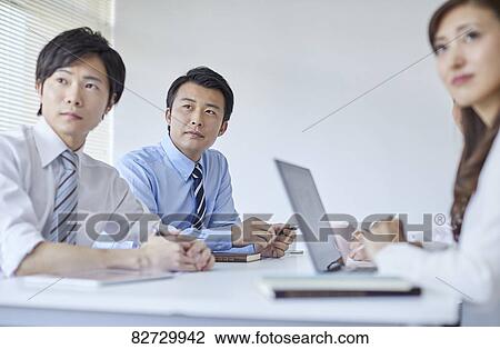 Japanese businesspeople in a meeting View Large Photo Image Stock Image - Japanese businesspeople in a meeting. Fotosearch