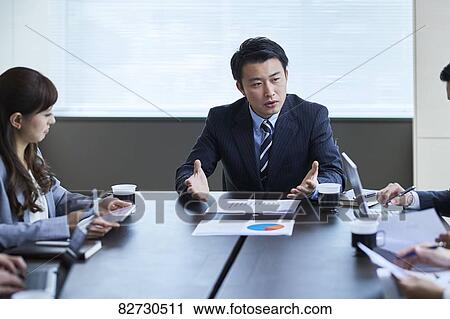 Japanese businesspeople in a meeting View Large Photo Image Stock Image - Japanese businesspeople in a meeting. Fotosearch