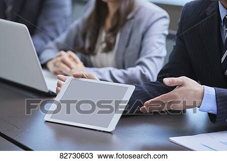Japanese businesspeople in a meeting View Large Photo Image Stock Image - Japanese businesspeople in a meeting. Fotosearch