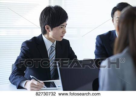 Japanese businesspeople in a meeting View Large Photo Image Stock Image - Japanese businesspeople in a meeting. Fotosearch