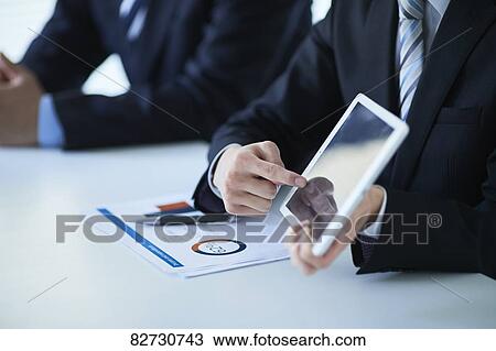 Japanese businesspeople in a meeting View Large Photo Image Stock Image - Japanese businesspeople in a meeting. Fotosearch