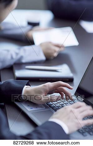 Japanese businesspeople in a meeting View Large Photo Image Stock Photo - Japanese businesspeople in a meeting. Fotosearch