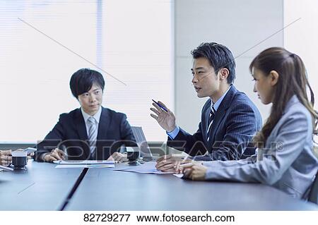 Japanese businesspeople in a meeting View Large Photo Image Stock Photo - Japanese businesspeople in a meeting. Fotosearch