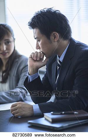 Japanese businesspeople in a meeting View Large Photo Image Stock Photo - Japanese businesspeople in a meeting. Fotosearch