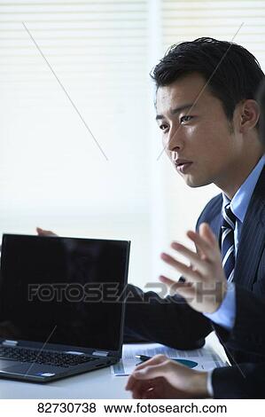 Japanese businesspeople in a meeting View Large Photo Image Stock Photo - Japanese businesspeople in a meeting. Fotosearch