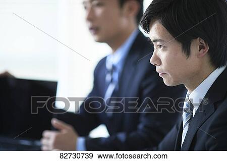Japanese businesspeople in a meeting View Large Photo Image Stock Photo - Japanese businesspeople in a meeting. Fotosearch