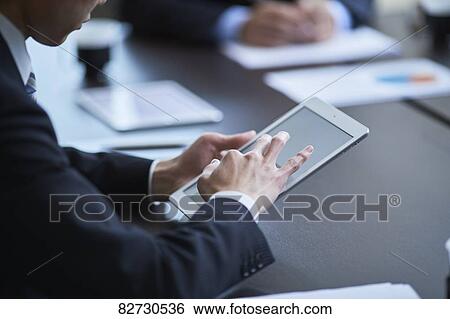 Japanese businesspeople in a meeting View Large Photo Image Stock Photograph - Japanese businesspeople in a meeting. Fotosearch