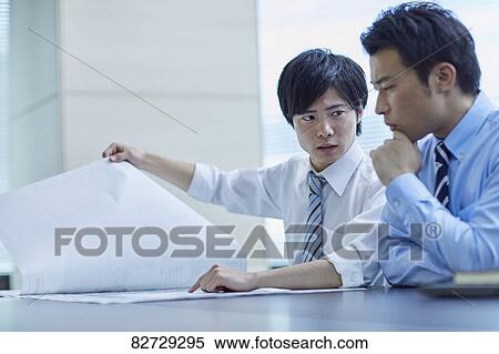 Stock Photography - Japanese businesspeople in a meeting. Fotosearch