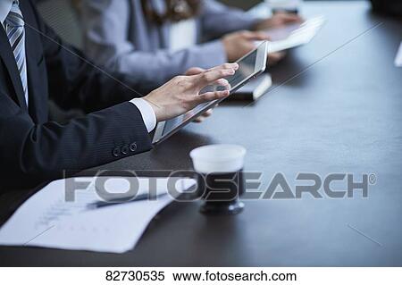 Japanese businesspeople in a meeting View Large Photo Image Stock Photography - Japanese businesspeople in a meeting. Fotosearch