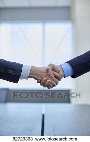 Japanese businesspeople shaking hands View Large Photo Image Stock Image - Japanese businesspeople shaking hands. Fotosearch