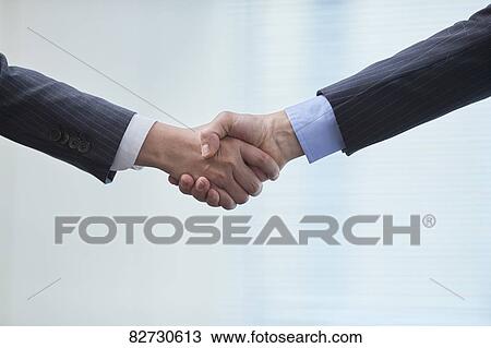 Japanese businesspeople shaking hands View Large Photo Image Stock Image - Japanese businesspeople shaking hands. Fotosearch