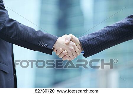 Japanese businesspeople shaking hands View Large Photo Image Stock Image - Japanese businesspeople shaking hands. Fotosearch