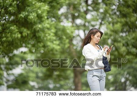 Japanese businesswoman downtown Tokyo View Large Photo Image Stock Image - Japanese businesswoman downtown Tokyo. Fotosearch