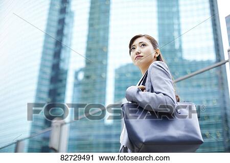Japanese businesswoman downtown Tokyo View Large Photo Image Stock Image - Japanese businesswoman downtown Tokyo. Fotosearch
