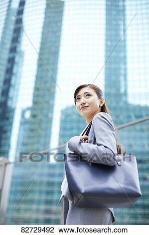 Japanese businesswoman downtown Tokyo View Large Photo Image Stock Image - Japanese businesswoman downtown Tokyo. Fotosearch