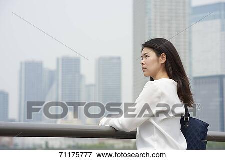 Japanese businesswoman downtown Tokyo View Large Photo Image Stock Photo - Japanese businesswoman downtown Tokyo. Fotosearch