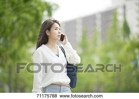 Japanese businesswoman downtown Tokyo View Large Photo Image Stock Photo - Japanese businesswoman downtown Tokyo. Fotosearch