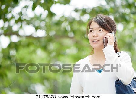 Japanese businesswoman downtown Tokyo View Large Photo Image Stock Photo - Japanese businesswoman downtown Tokyo. Fotosearch