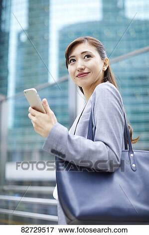 Japanese businesswoman downtown Tokyo View Large Photo Image Stock Photo - Japanese businesswoman downtown Tokyo. Fotosearch
