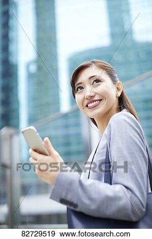 Stock Photo - Japanese businesswoman downtown Tokyo. Fotosearch