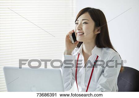 Japanese businesswoman in the office View Large Photo Image Stock Image - Japanese businesswoman in the office. Fotosearch