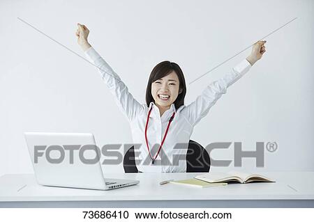 Stock Image - Japanese businesswoman in the office. Fotosearch