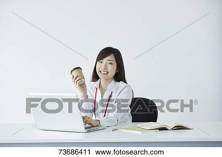 Japanese businesswoman in the office View Large Photo Image Stock Image - Japanese businesswoman in the office. Fotosearch