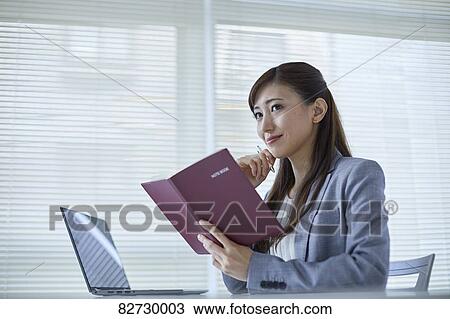 Japanese businesswoman in the office View Large Photo Image Stock Image - Japanese businesswoman in the office. Fotosearch