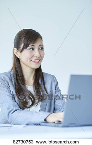 Stock Image - Japanese businesswoman in the office. Fotosearch