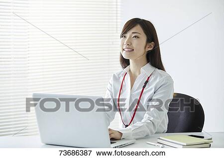 Stock Photo - Japanese businesswoman in the office. Fotosearch