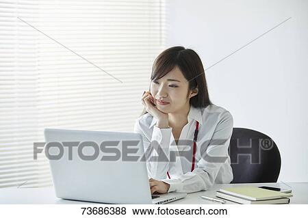 Japanese businesswoman in the office View Large Photo Image Stock Photo - Japanese businesswoman in the office. Fotosearch