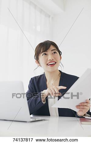 Stock Photo - Japanese businesswoman in the office. Fotosearch