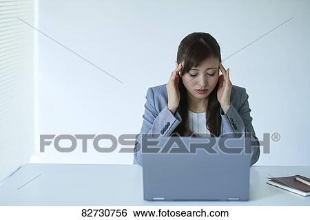 Japanese businesswoman in the office View Large Photo Image Stock Photograph - Japanese businesswoman in the office. Fotosearch