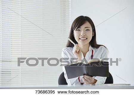 Stock Photography - Japanese businesswoman in the office. Fotosearch