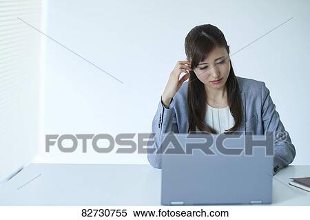Stock Photography - Japanese businesswoman in the office. Fotosearch