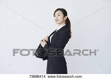 Picture - Japanese businesswoman on white background. Fotosearch