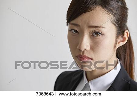 Stock Image - Japanese businesswoman on white background. Fotosearch